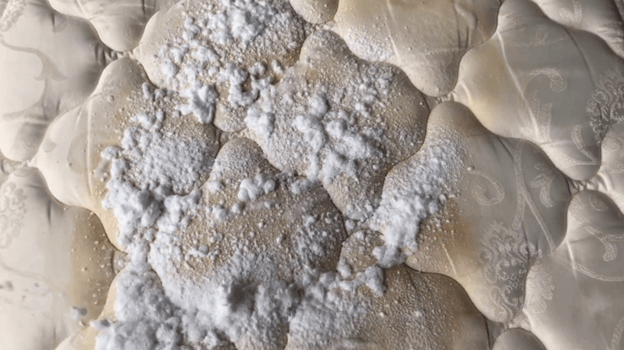Cleaning a food or drink stain off a mattress