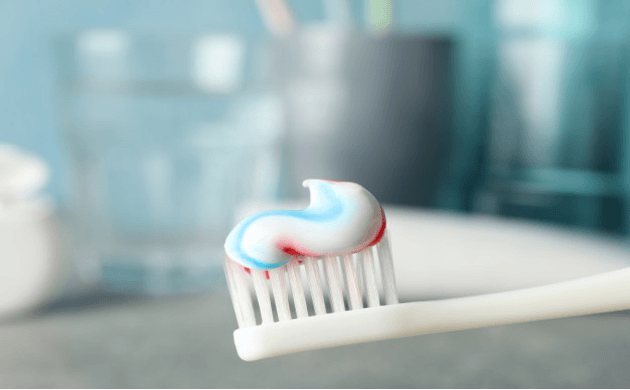 brush with toothpaste