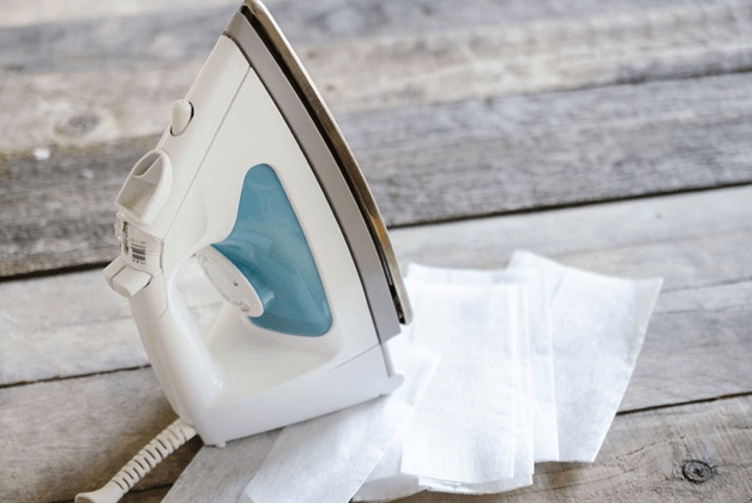 iron on the wooden table